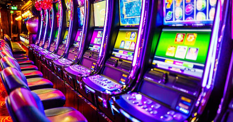 Line of electronic slot machines in casino. Property released.